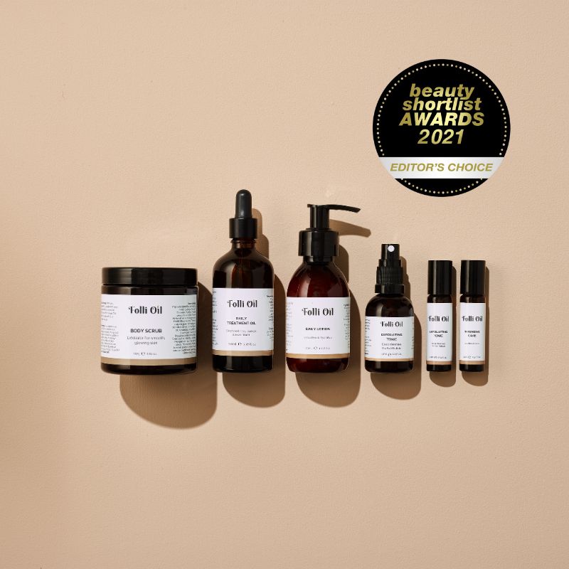 Flat lay of Folli Oil products with Beauty Shortlist Awards Editor's Choice certificate.